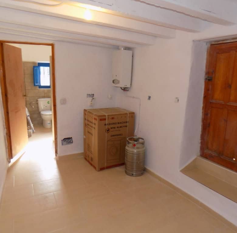 Interior view of a rustic village property in Sierro, Almeria, featuring simple decor and traditiona.
