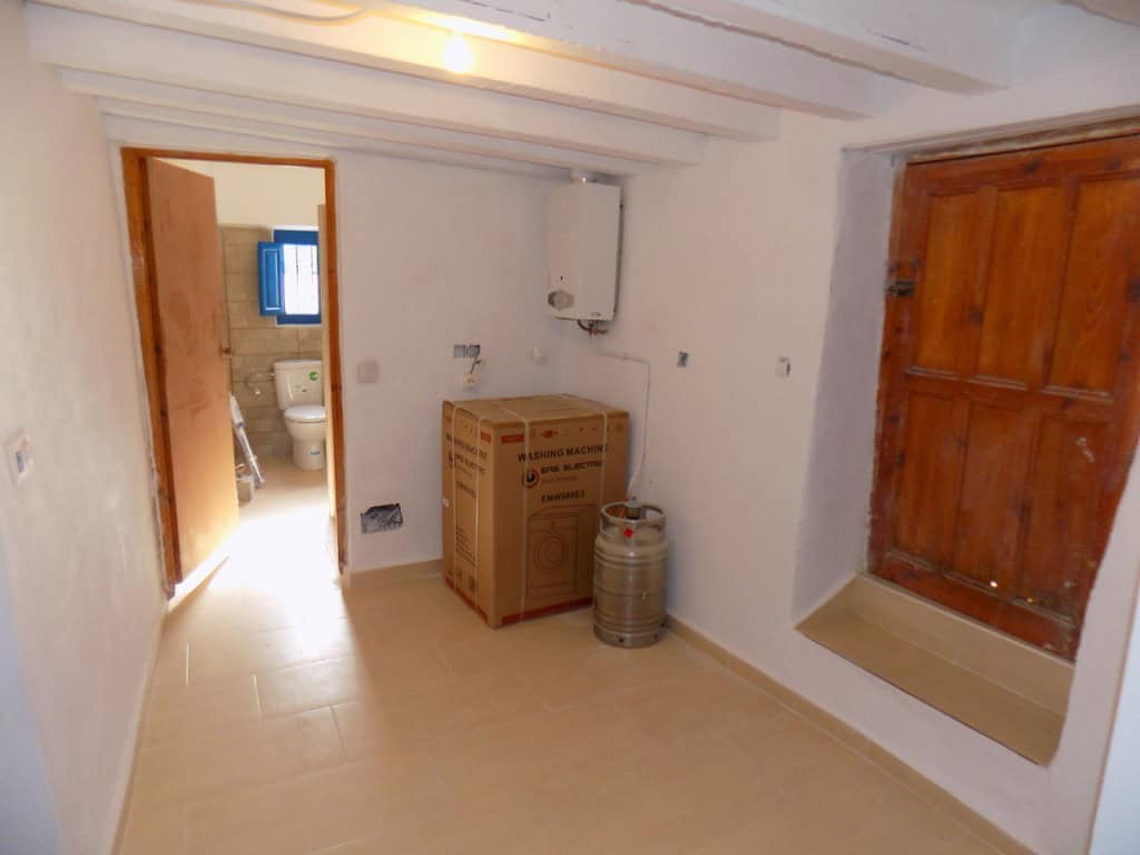 Interior view of a rustic village property in Sierro, Almeria, featuring simple decor and traditiona.