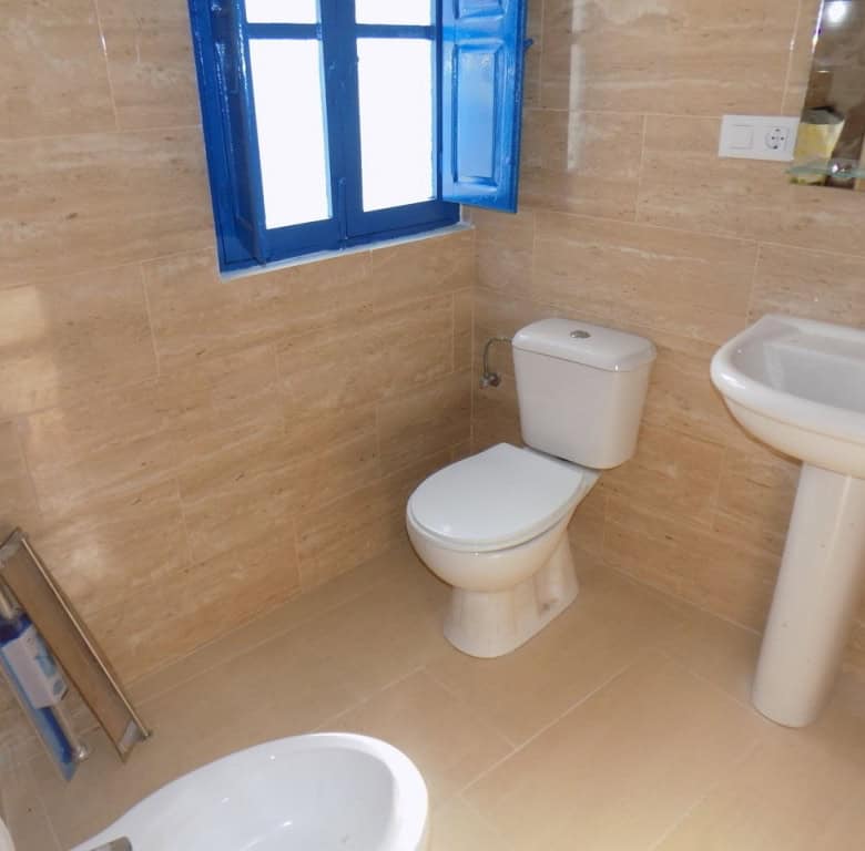 Cozy bathroom with modern fixtures in a traditional village home in Sierro, Almeria.
