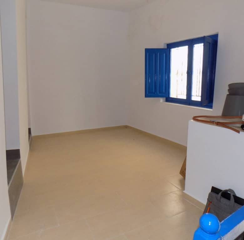 Charming village property in Sierro, Almeria with bright interior and traditional blue window shutte.