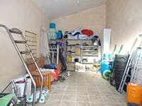 Interior view of a cluttered storage room in a rural property in Oria, Almeria.