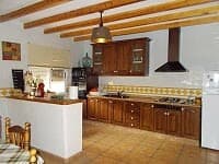 Beautiful rural kitchen in Oria, Almeria with traditional wooden cabinets and rustic charm.