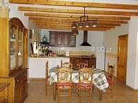 Beautiful rural property interior in Oria, Almeria with traditional wooden beams and cozy dining are.