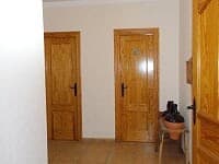 Interior view of rural property in Oria, Almeria with wooden doors and simple decor.