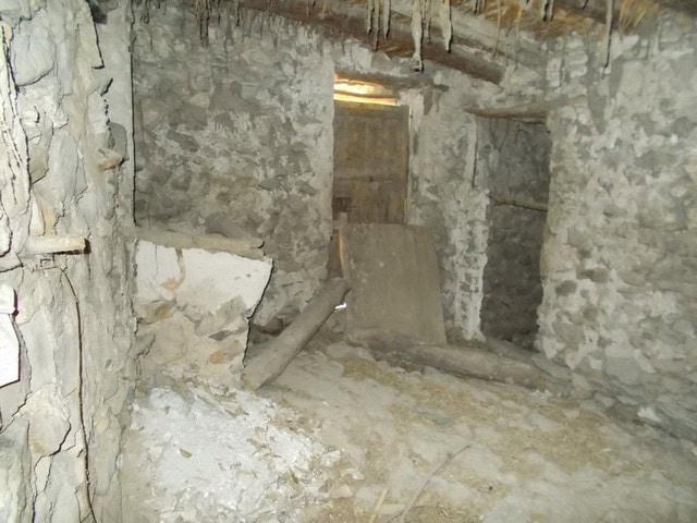 Traditional stone-built village house in Tijola, Almeria, with rustic interior and potential for ren.
