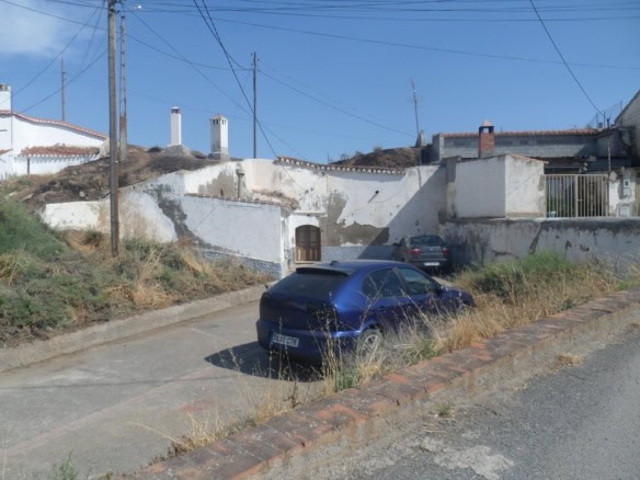 Cave house in Guadix, Granada with whitewashed walls and traditional architecture.