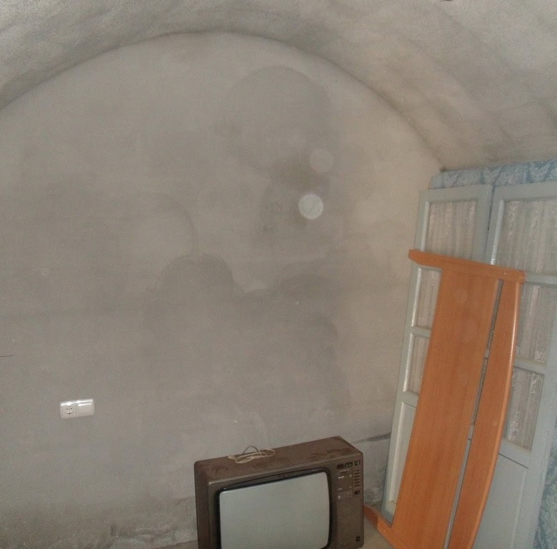 Cave house interior in Guadix, Granada, showcasing traditional underground living space.