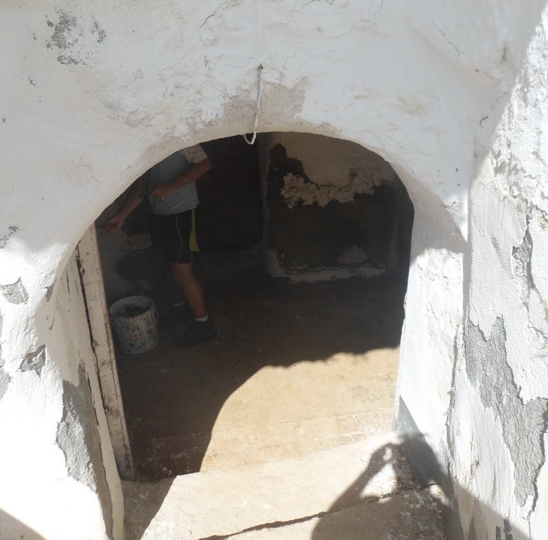Cave house entrance in Guadix, Granada, showcasing traditional subterranean architecture.