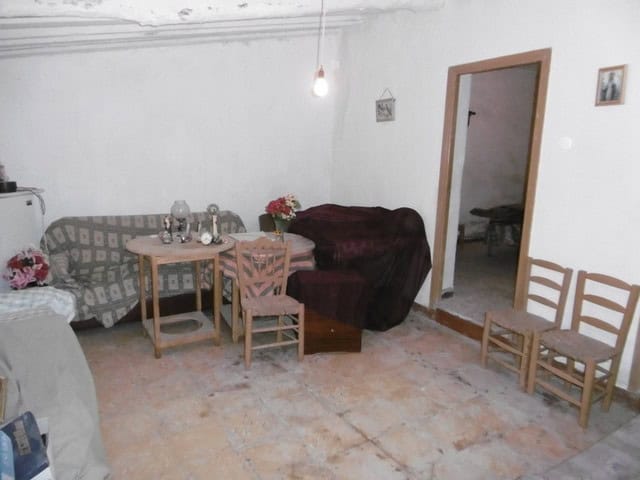Interior view of a town house in Tijola, Almeria, showcasing a cozy living and dining area.