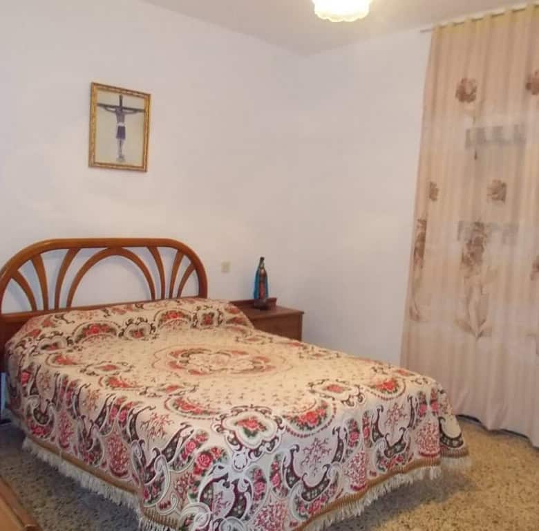 Cozy bedroom in a traditional village house in Seron, Almeria, featuring classic decor and peaceful.