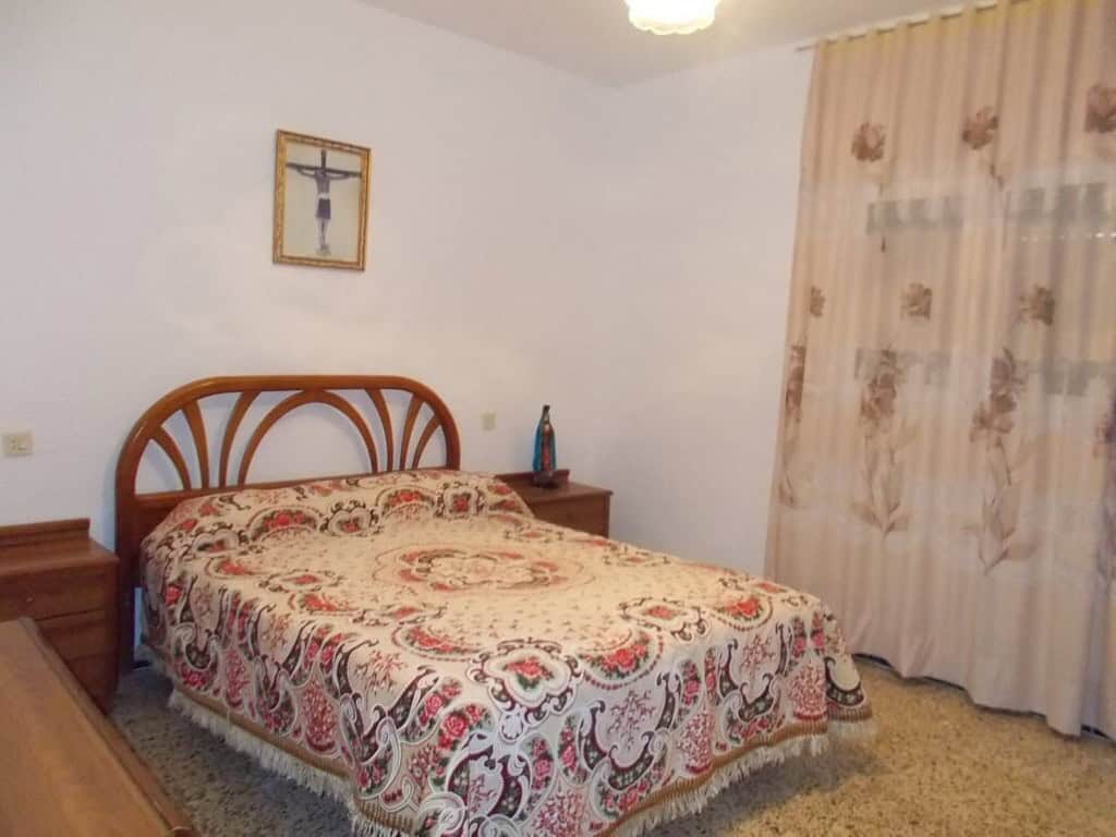 Cozy bedroom in a traditional village house in Seron, Almeria, featuring classic decor and peaceful.