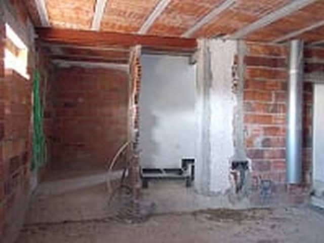 Charming village property under construction in Seron, Almeria, with rustic brick walls and open int.