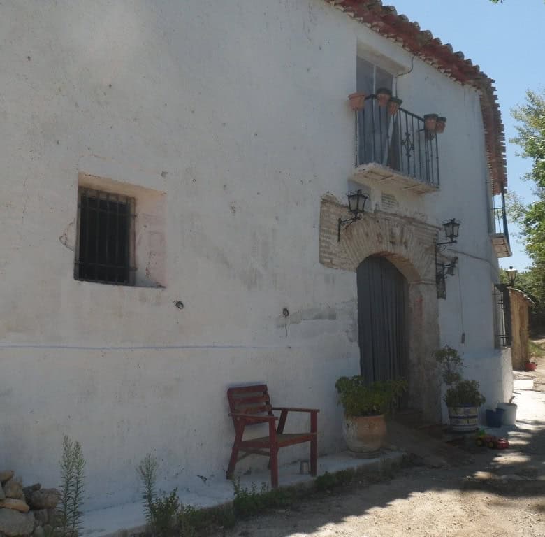 Farm property in Zujar, Granada with traditional white walls and rustic charm.
