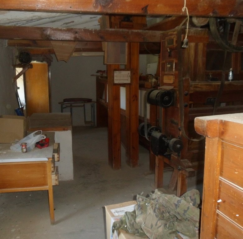 Farm property interior with rustic wooden beams and traditional furnishings in Zujar, Granada.