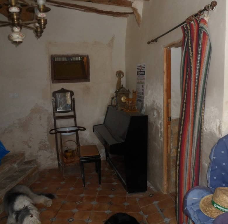 Cozy rustic farm room with vintage furniture and traditional decor in Zujar, Granada.