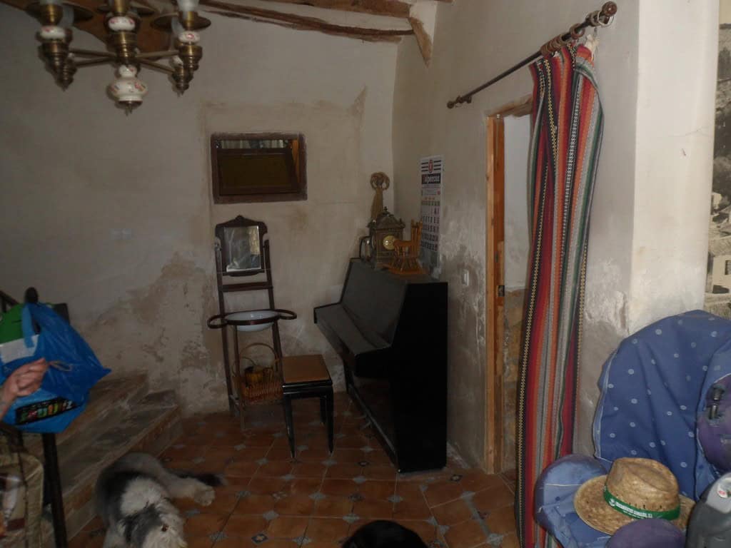 Cozy rustic farm room with vintage furniture and traditional decor in Zujar, Granada.