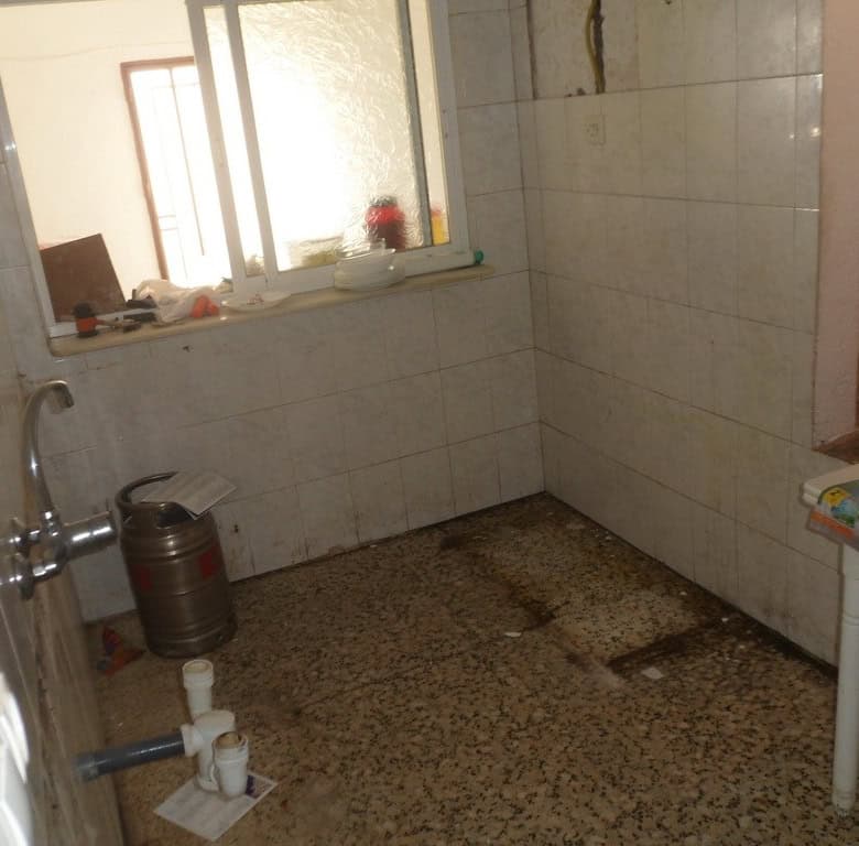 Interior of a rustic town house bathroom in Freila, Granada.