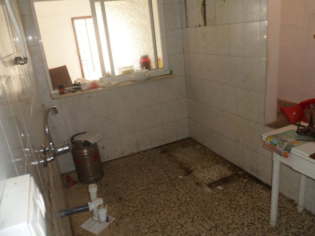 Interior of a rustic town house bathroom in Freila, Granada.