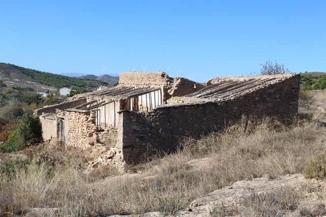 Old stone rural house in Tijola, Almeria, Spain, with scenic mountain views and dry landscape.
