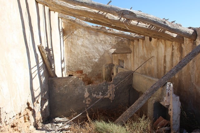 Abandoned rural property with rustic walls and wooden beams in Tijola, Almeria.