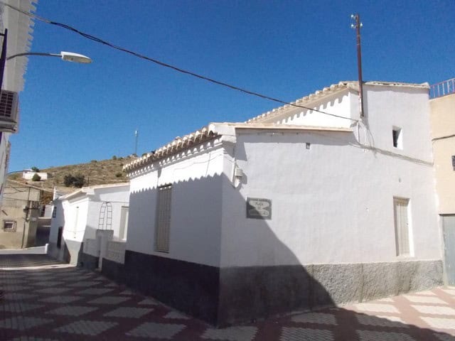 Charming white village house in Tijola, Almeria, with traditional architecture and sunny outdoor spa.