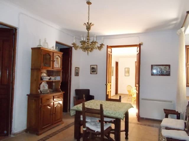 Charming village home interior with traditional furniture and a cozy dining area in Tijola, Almeria.