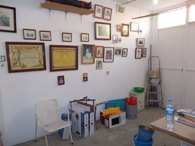 Village Property in Cela, Almeria with charming interior decor and framed artwork on the walls.