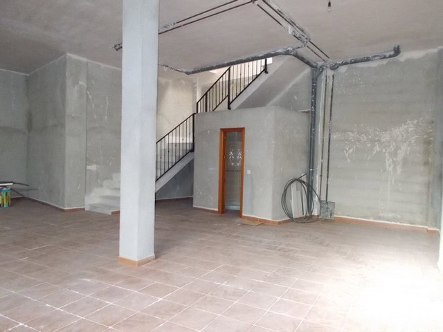 Village property interior with unfinished walls and staircase in Lucar, Almeria, Spain.