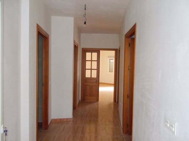 Charming village property interior with wooden doors and tiled flooring in Lucar, Almeria.