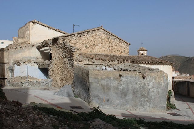 Village property in Lucar, Almeria with traditional stone buildings and scenic mountain views.