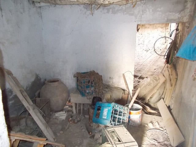 Abandoned village property in Lucar, Almeria, showing construction and renovation materials.