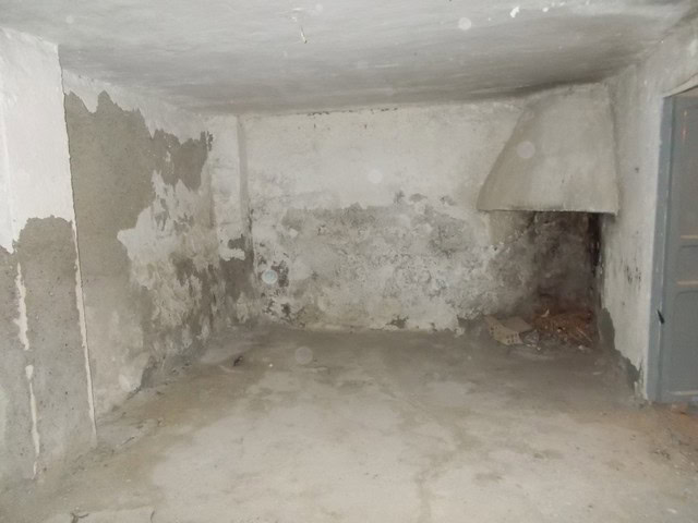Old interior of a town house in Tijola, Almeria, showing unfinished walls and floor.