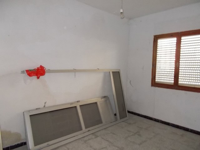 Town House interior with window and construction materials in Tijola, Almeria.