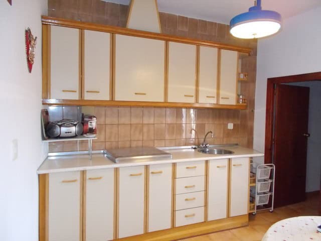 Village property kitchen with wooden cabinets in Seron, Almeria, Spain.