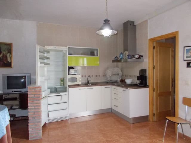 Charming kitchen in a village property in Seron, Almeria, featuring modern appliances and rustic dec.