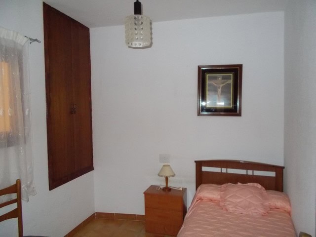 Charming bedroom in a village property in Seron, Almeria, with simple furnishings and cozy atmospher.