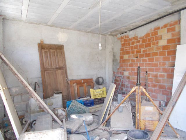 Charming village property in Hijate, Almeria, under renovation with construction materials inside.