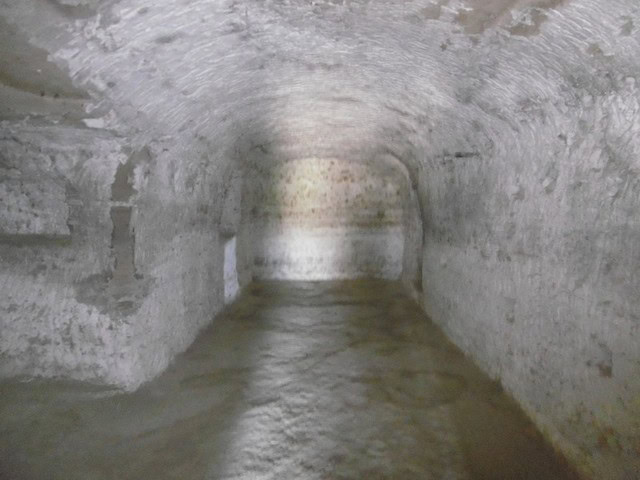 Cave house interior in Benamaurel, Granada, showcasing traditional underground living space.