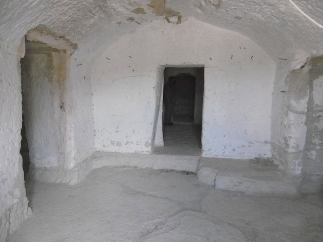 Cave house interior with whitewashed walls and arched ceilings in Benamaurel, Granada. Unique underg.