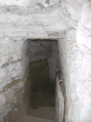 Ancient cave house entrance in Benamaurel, Granada, showcasing traditional underground living spaces.