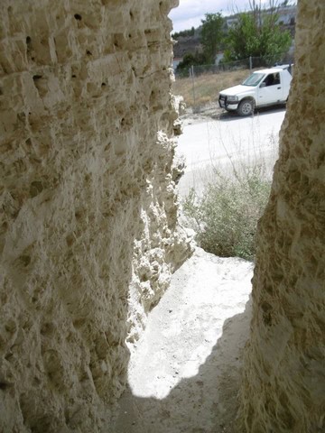 Cave house entrance with stone walls in Benamaurel, Granada, offering a unique rural living experien.