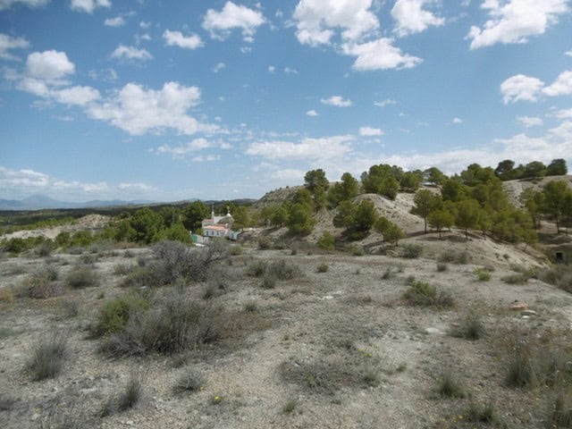 Cave house nestled in the hills of Benamaurel, Granada, offering a unique living experience in a sce.