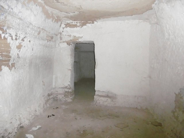 Cave house interior in Benamaurel, Granada, showcasing traditional underground living space.