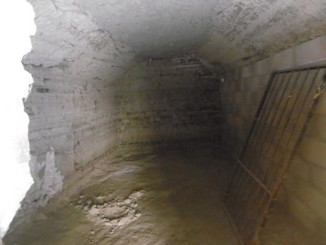 Cave house interior in Benamaurel, Granada, showcasing traditional underground living space.