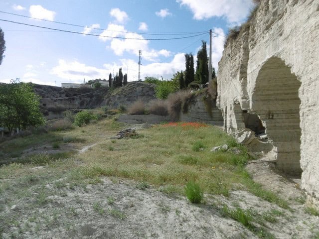 Cave house in Benamaurel, Granada, with natural rock formations and scenic landscape.