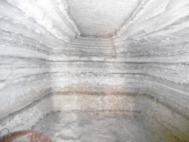 Cave house interior in Benamaurel, Granada, showcasing unique rock formations and traditional constr.