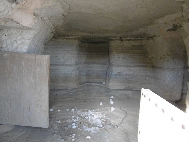Cave house interior with natural rock walls in Benamaurel, Granada, offering a unique living space.