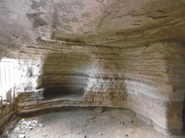 Cave house interior in Benamaurel, Granada, showcasing natural rock formations and unique living spa.