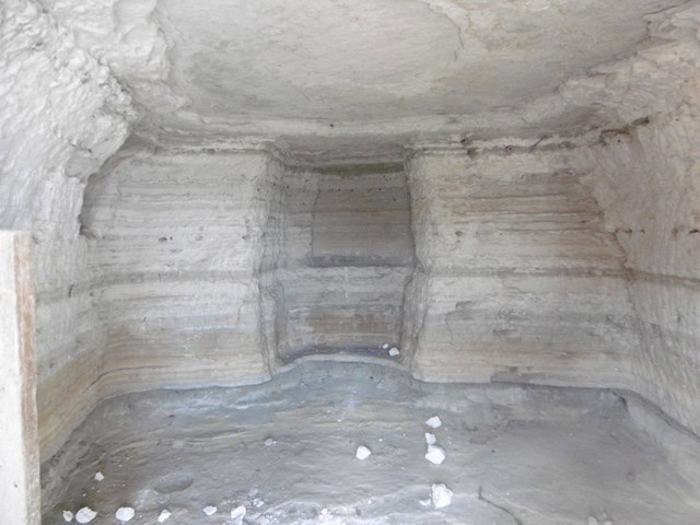 Cave house interior with natural rock walls in Benamaurel, Granada, showcasing traditional cave dwel.