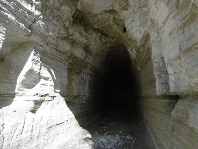 Cave house entrance in Benamaurel, Granada, carved into limestone cliffs.